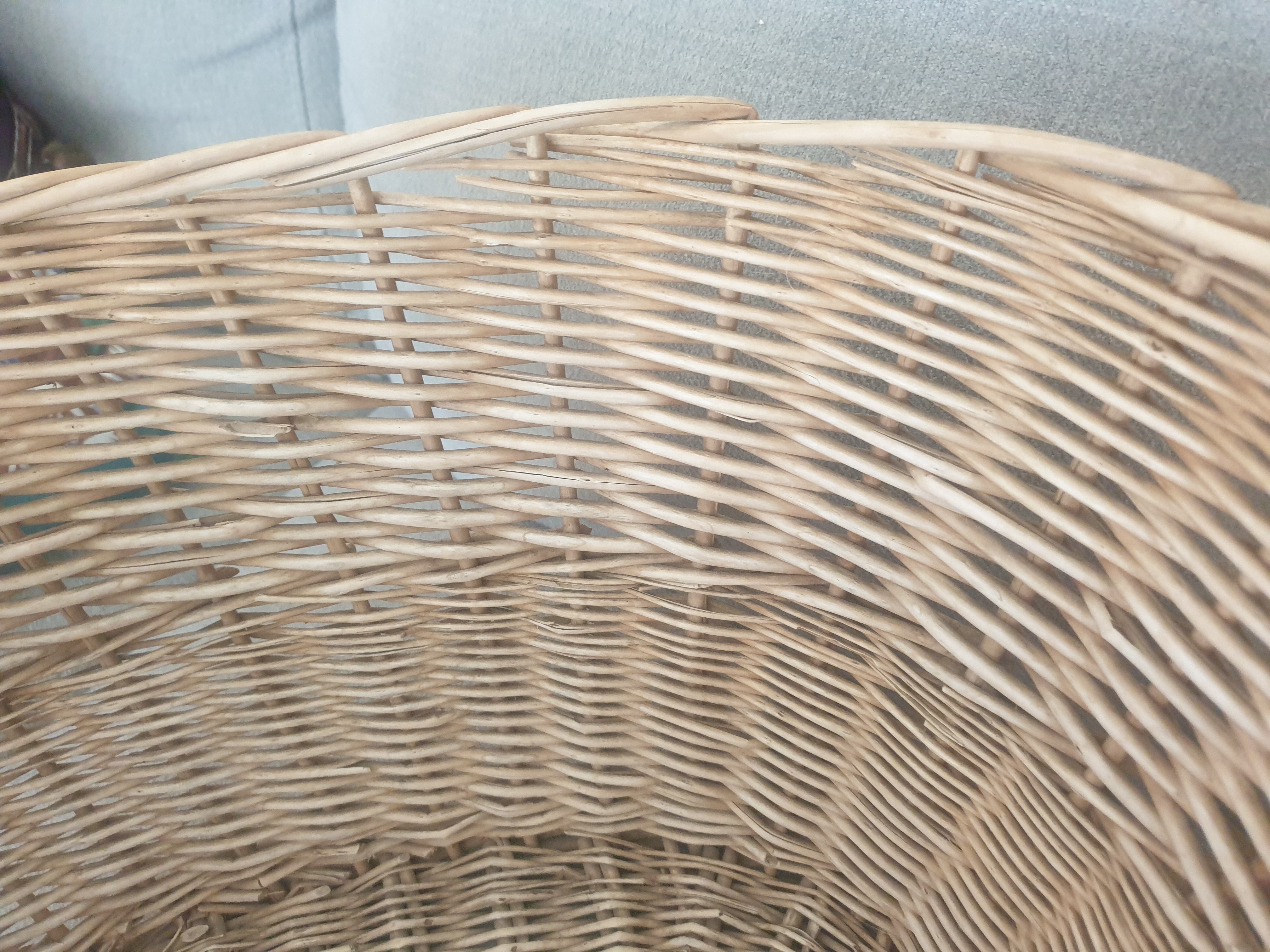 Close up on the inside of a wicker basket. There are no visible handles.